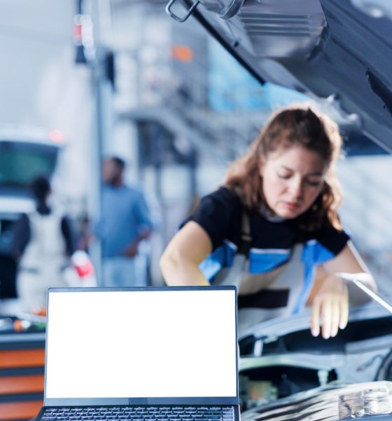 mockup-laptop-with-blurry-background-serviceman-changing-old-car-gear-oil-with-new-one-repair-shop-isolated-screen-device-hardworking-woman-garage-using-equipment-vehicle-checkup